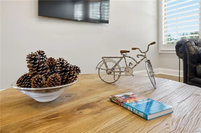 a view of a livingroom with furniture and a window