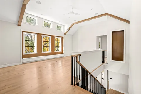 a view of an entryway with wooden floor