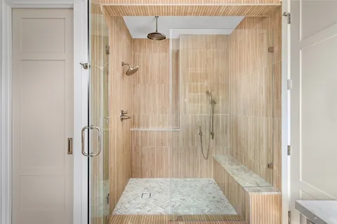 a bathroom with a shower and a sink