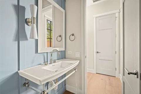 a bathroom with a sink vanity and a mirror