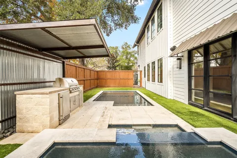 a view of a backyard with sitting area