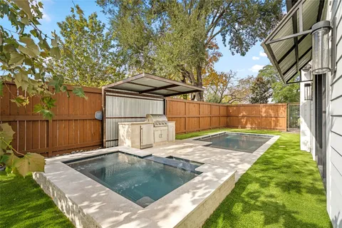 a view of a backyard with a small cabin