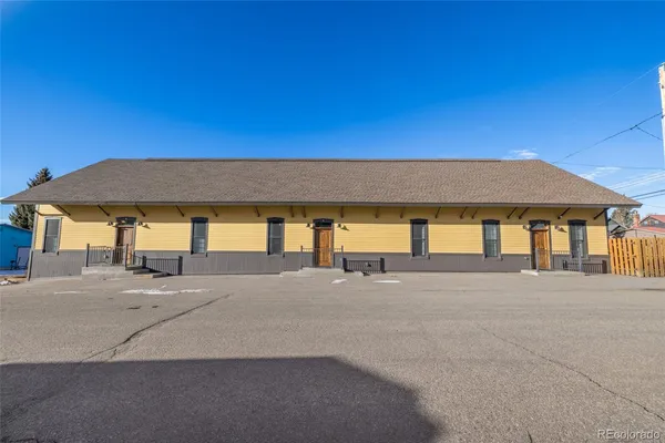 a view of building with parking
