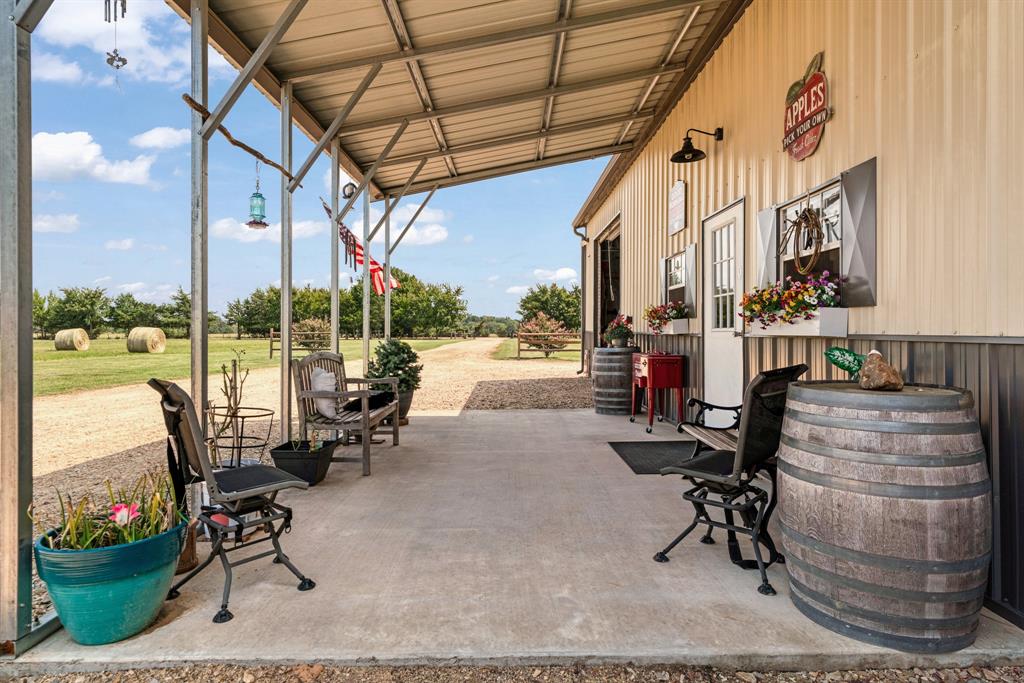 1750 County Road 34430 Sumner, TX 75486 - Photo 16 of 20 a building outdoor space with patio furniture and ocean view