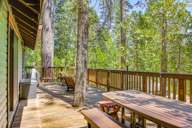 a kitchen with a refrigerator and wooden cabinets