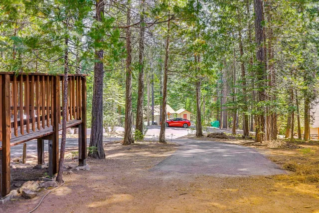 a kitchen with stainless steel appliances granite countertop a refrigerator a sink and dishwasher