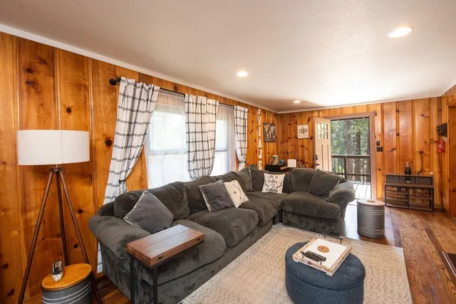 a bedroom with a large bed and a large window