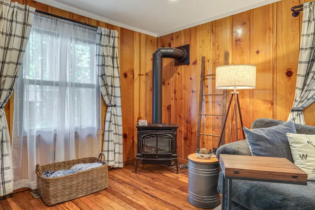 a bedroom with a bed and a bookshelf