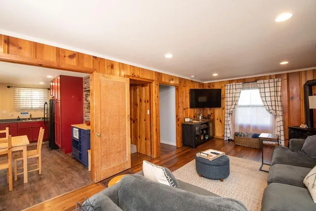 a bathroom with a sink toilet a mirror and shower