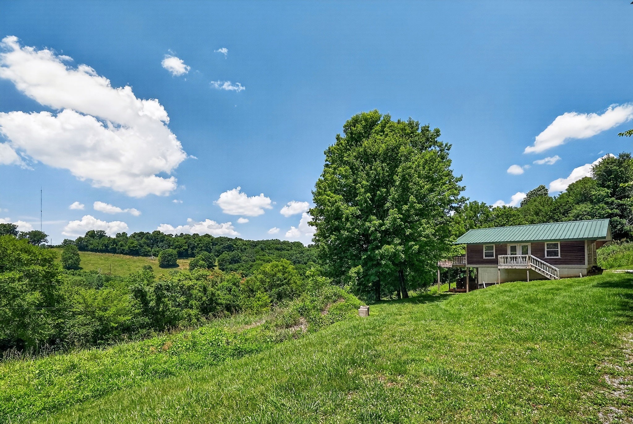 99 Judkins Road Hickman, TN 38567 - Photo 24 of 62 a house view with a garden space