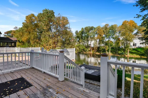 a view of a balcony with wooden floor space