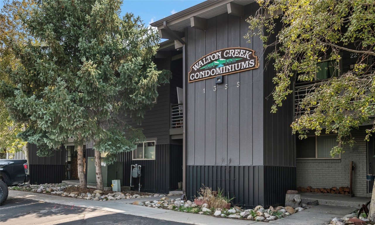 1355 Walton Creek Road, Unit 20 Steamboat Springs, CO 80487 - Photo 1 of 43 a sign on the side of a building