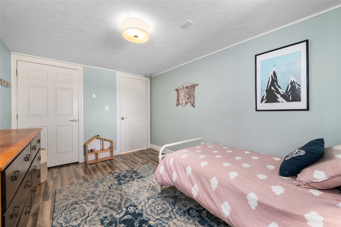1355 Walton Creek Road, Unit 20 Steamboat Springs, CO 80487 - Photo 29 of 43 a bedroom with a bed and a cabinets