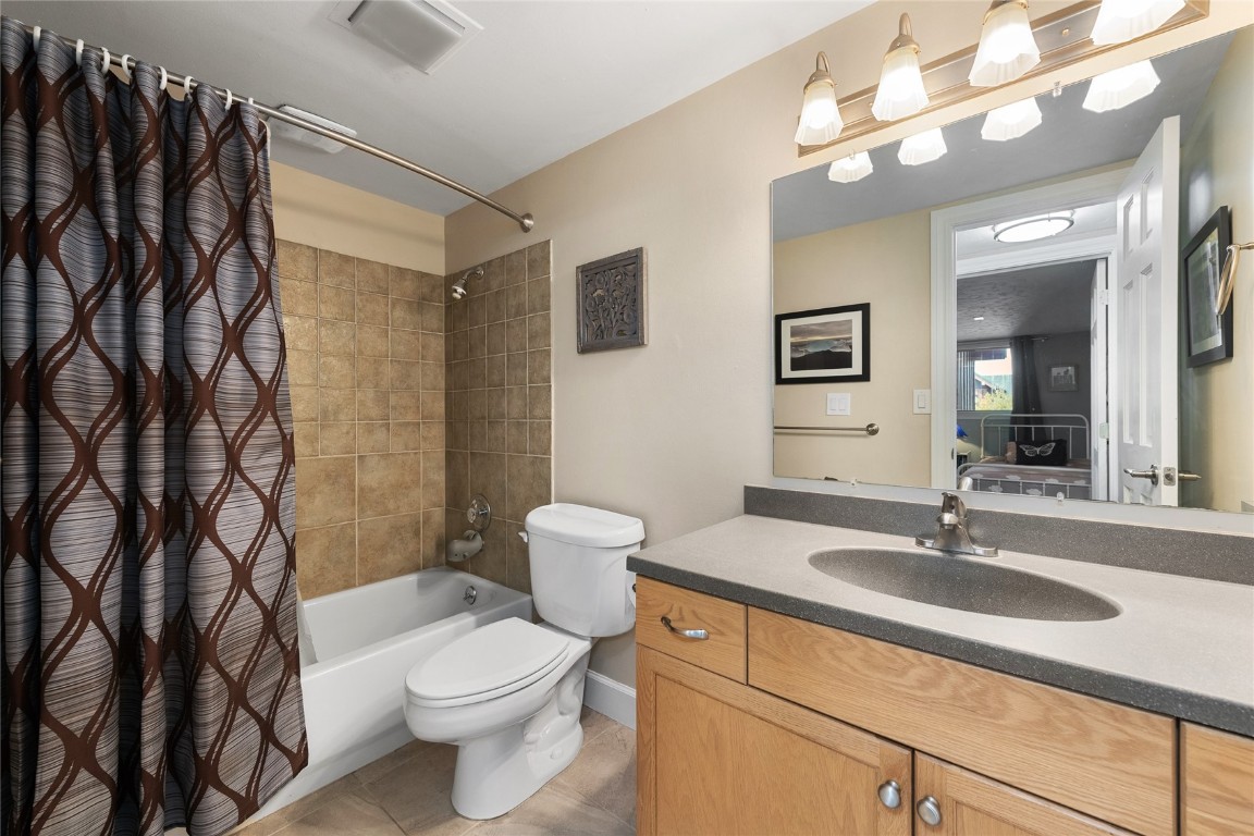 1355 Walton Creek Road, Unit 20 Steamboat Springs, CO 80487 - Photo 30 of 43 a bathroom with a sink a toilet and shower