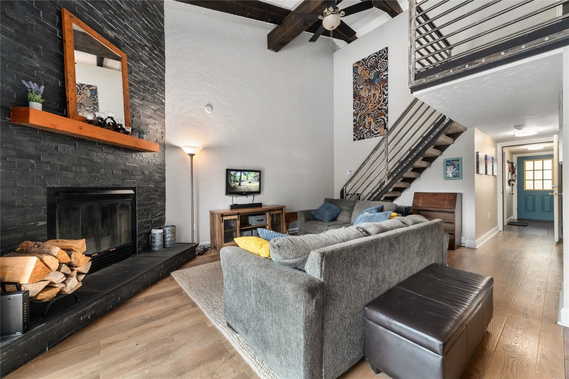 1355 Walton Creek Road, Unit 20 Steamboat Springs, CO 80487 - Photo 3 of 43 a living room with couches and a fireplace