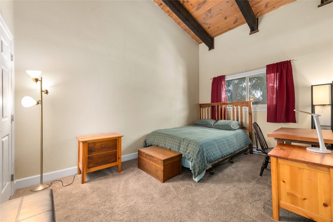 1355 Walton Creek Road, Unit 20 Steamboat Springs, CO 80487 - Photo 31 of 43 a bedroom with a bed and dresser