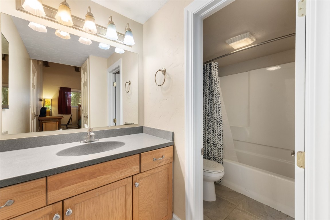 1355 Walton Creek Road, Unit 20 Steamboat Springs, CO 80487 - Photo 34 of 43 a bathroom with a sink a toilet and shower