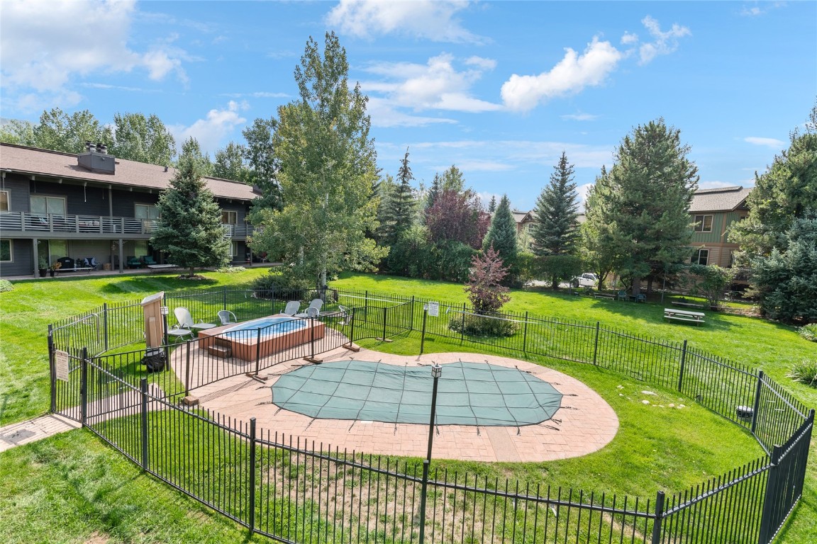 1355 Walton Creek Road, Unit 20 Steamboat Springs, CO 80487 - Photo 41 of 43 a view of a backyard with sitting area
