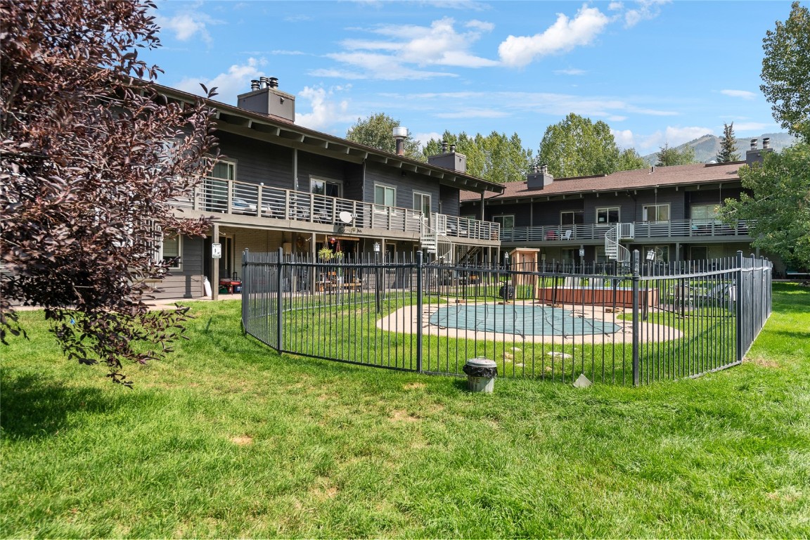 1355 Walton Creek Road, Unit 20 Steamboat Springs, CO 80487 - Photo 43 of 43 a view of a house with a backyard