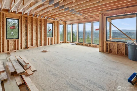 a view of an empty room with wooden walls