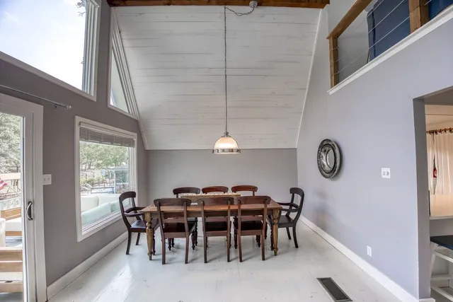 a view of a livingroom with furniture and chandelier
