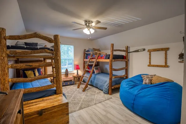 a bedroom with furniture and a gym equipment