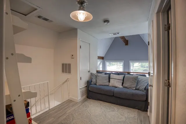 a bedroom with furniture and a book shelf