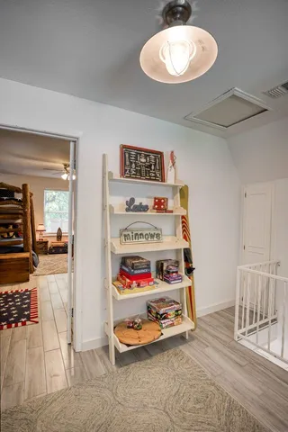 a bathroom with a sink vanity and mirror