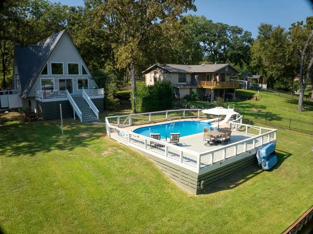 a view of a swimming pool with a patio
