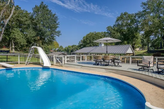 a view of a lake with a white house