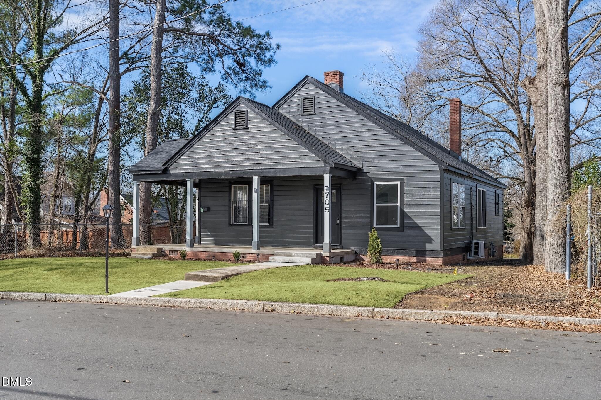 705 North Driver Street Durham, NC 27703 - Photo 3 of 46 a front view of a house with a yard and garage