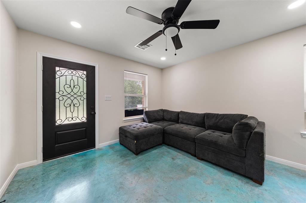 3109 North 27th Street Waco, TX 76708 - Photo 4 of 17 a living room with furniture and a window