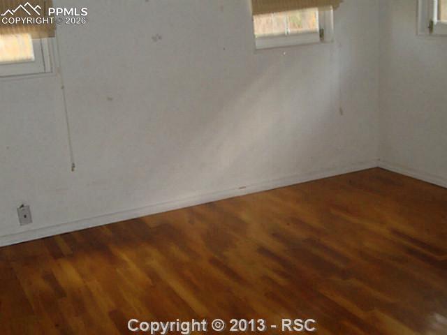 9390 Mountain Road Cascade, CO 80809 - Photo 5 of 7 an empty room with a window