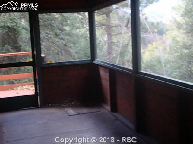 9390 Mountain Road Cascade, CO 80809 - Photo 7 of 7 a view of an empty room with a window