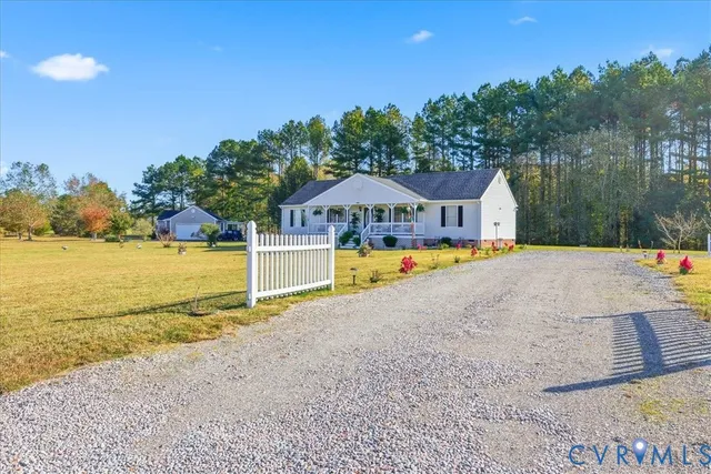 a view of a swimming pool with an outdoor space and seating area