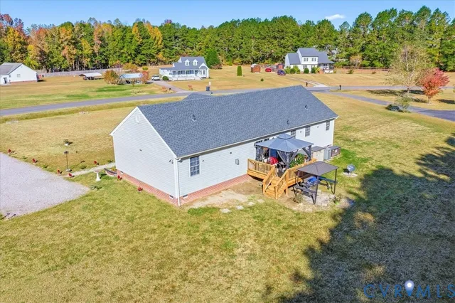 an aerial view of a house with garden space and houses view