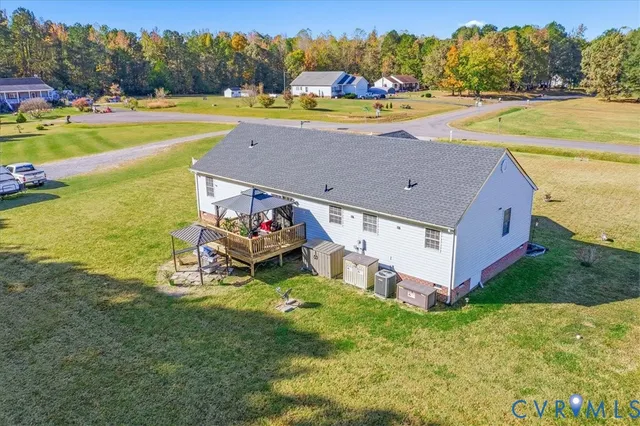 a view of a swimming pool with an ocean and trees in the background