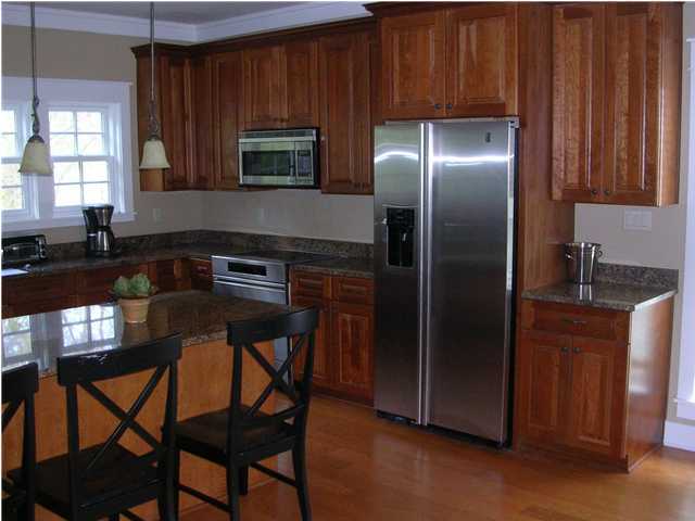 102 Willow Mist Road Inlet Beach, FL 32461 - Photo 5 of 15 a kitchen with stainless steel appliances granite countertop a stove refrigerator and microwave