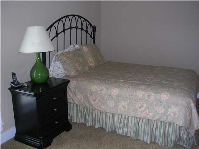 102 Willow Mist Road Inlet Beach, FL 32461 - Photo 7 of 15 a bedroom with a bed and a lamp on table