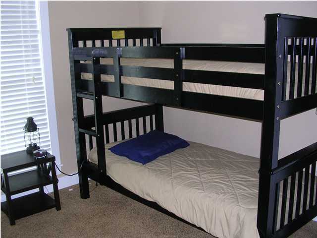 102 Willow Mist Road Inlet Beach, FL 32461 - Photo 8 of 15 a bed sitting in a bedroom next to a window