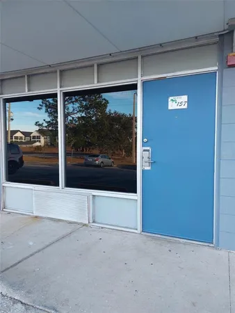 a view of a glass door with the balcony
