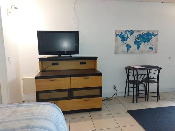 a room with furniture and a flat screen tv
