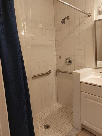 a bathroom with a sink and mirror