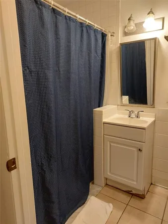 a bathroom with sink a mirror a vanity and window