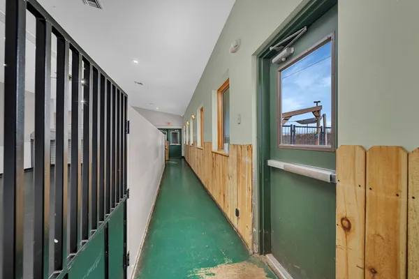 a view of a hallway with a window