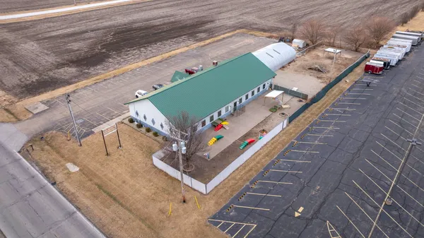 an aerial view of residential houses with outdoor space