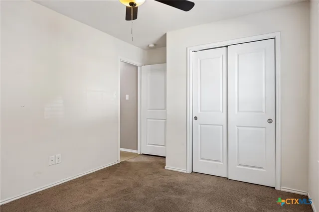 an empty room with closet area