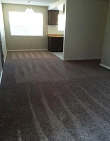 a bathroom with a granite countertop shower and a toilet
