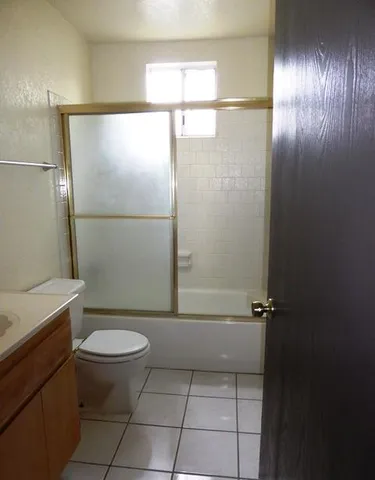 a kitchen with a sink cabinets and a window