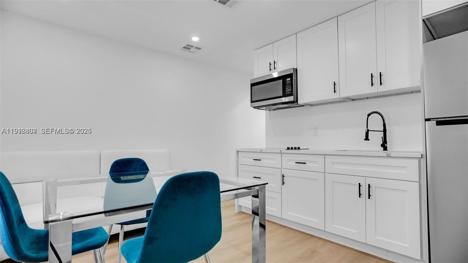 a view of cabinets a sink and dishwasher in a kitchen